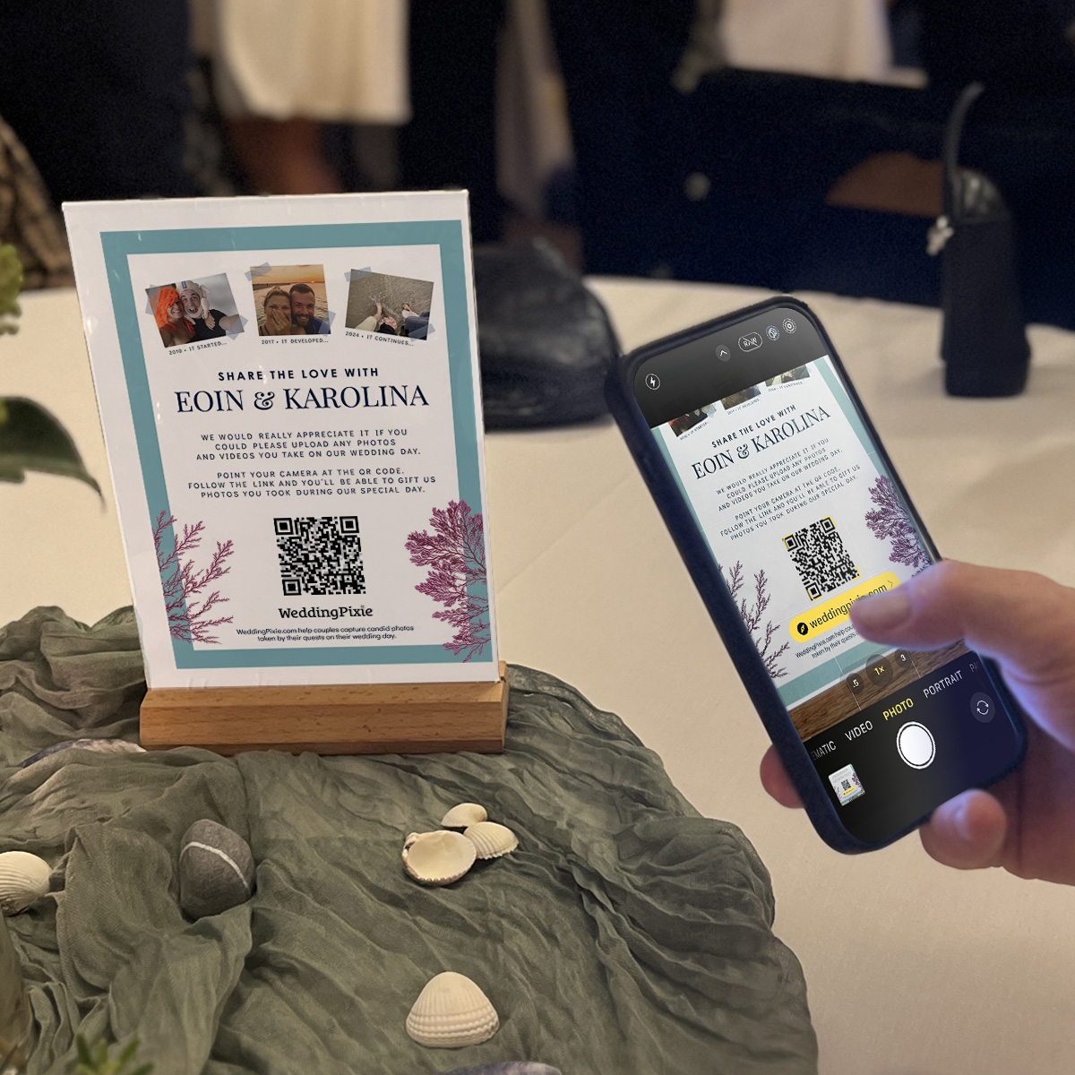 QR Code on a card at a wedding drinks reception being scanned with a mobile phone